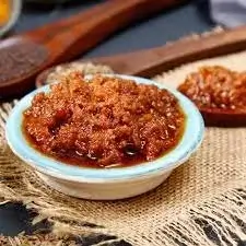Homemade Andhra mutton keema pickle with rich spices
